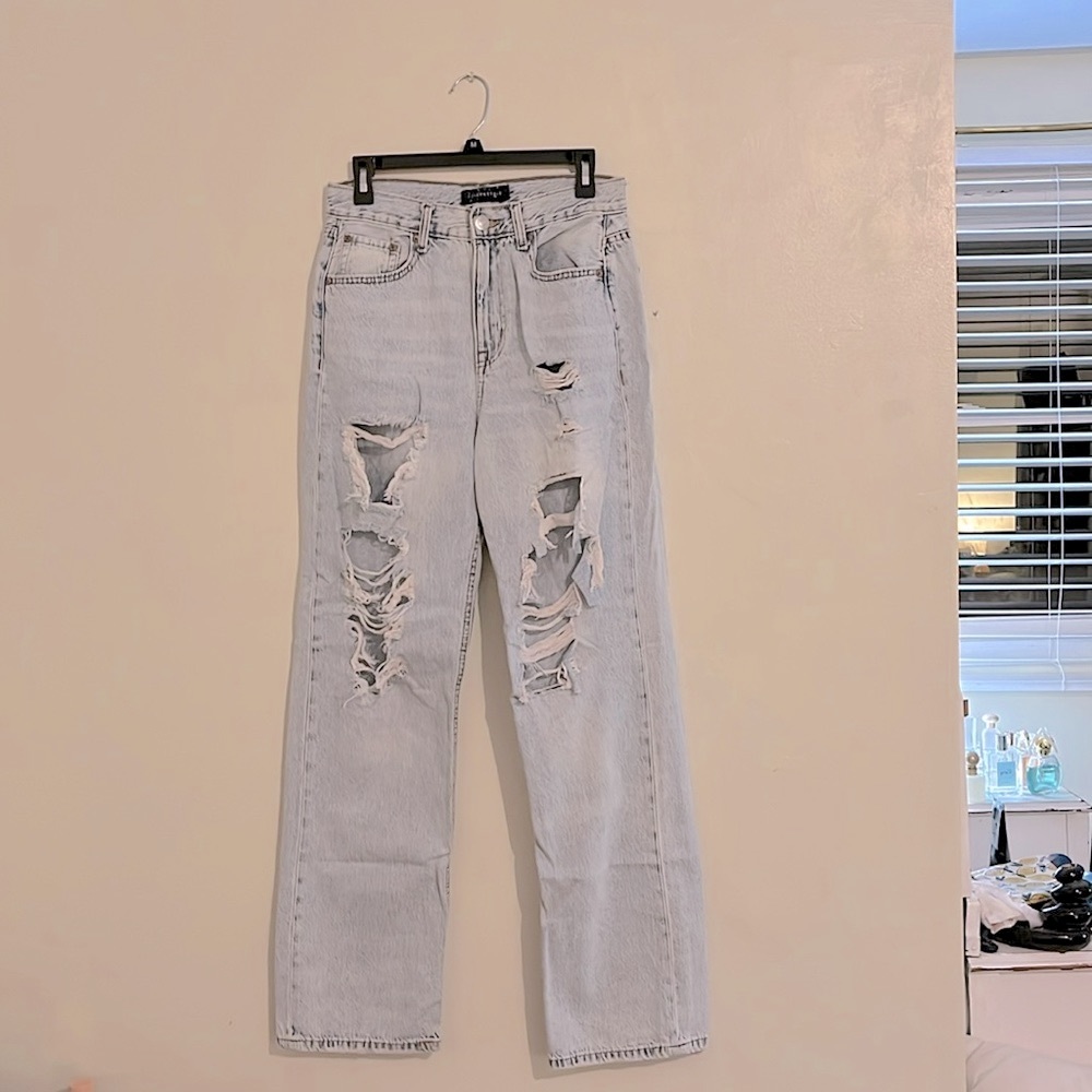 Acid washed wide leg high rise distressed jeans